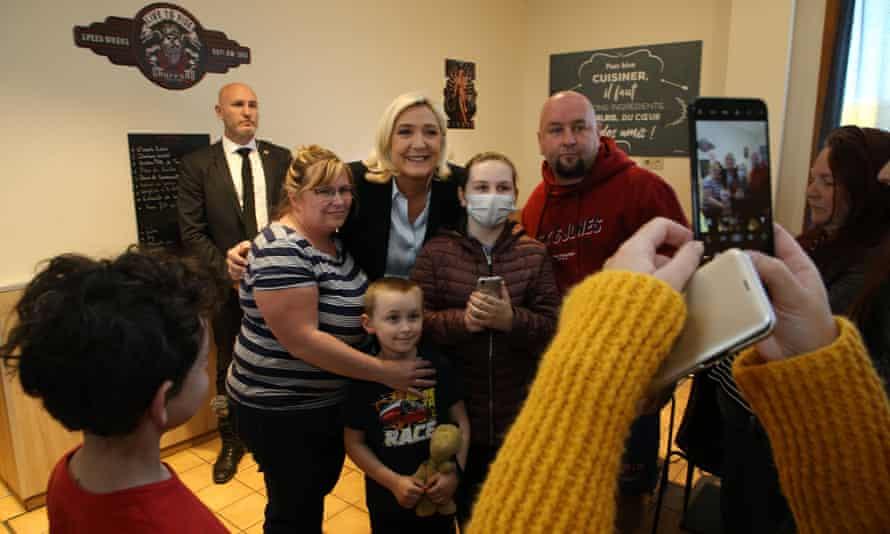 Marine Le Pen poses for a photo at a truck stop restaurant in Roye