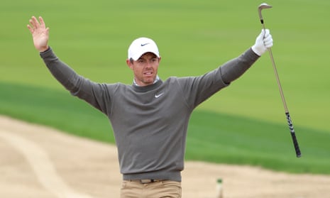 Rory McIlroy reacts after holing his second shot from a fairway bunker for an eagle.
