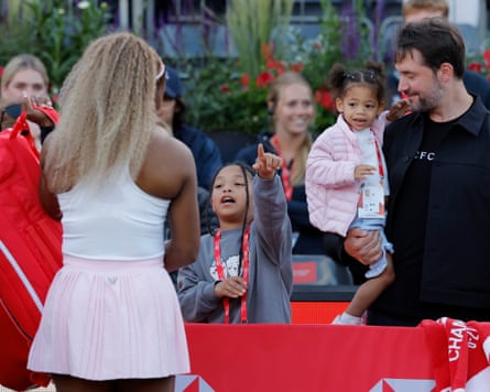 Serena Williams is greeted by her eldest daughter Olympia and watched by her husband Alexis Ohanian and youngest daughter Adira River Ohanian after her victory.
