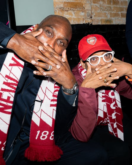 Sol Campbell and Spike Lee with their hands across their mouths in New York