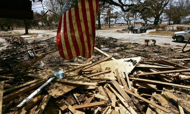 A US flag hangs from the roof of a home destroyed by Hurricane Katrina in Mississippi in 2005.