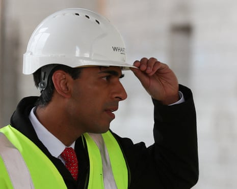 Rishi Sunak in a white hard hat and yellow hi-vis vest