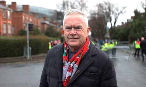 Huw Edwards wearing a Welsh rugby scarf
