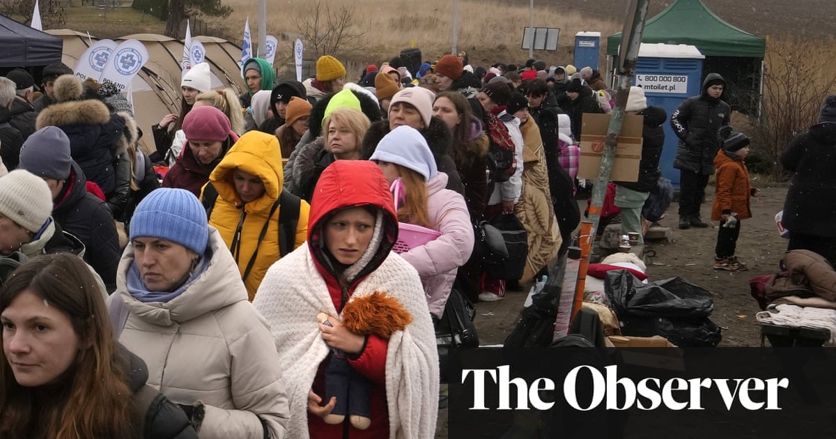 ‘We understand what war means’: Poles rush to aid Ukraine’s refugees