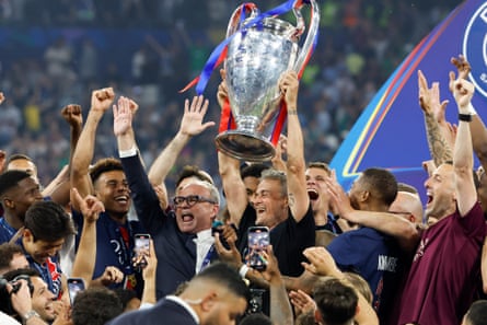 Luis Enrique holds up the Champions League trophy