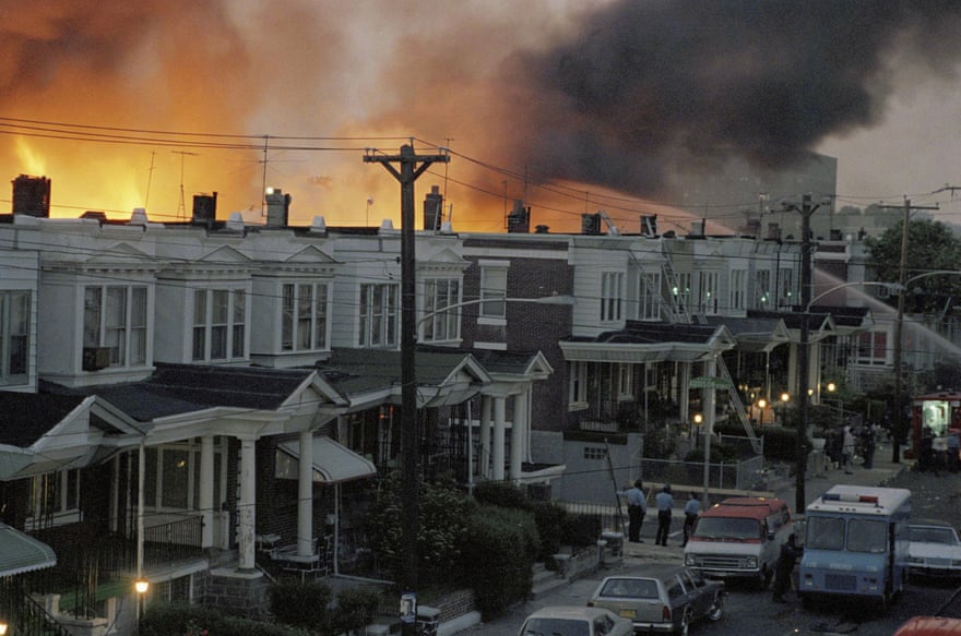 A May 1985 photo shows row houses burning in a fire in the West Philadelphia neighborhood after police dropped a bomb on the Move home.