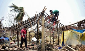 Indian residents rebuild houses after they got destroyed by the cyclone 'Fani' in Puri in the eastern Indian state of Odisha on 12 May 2019.