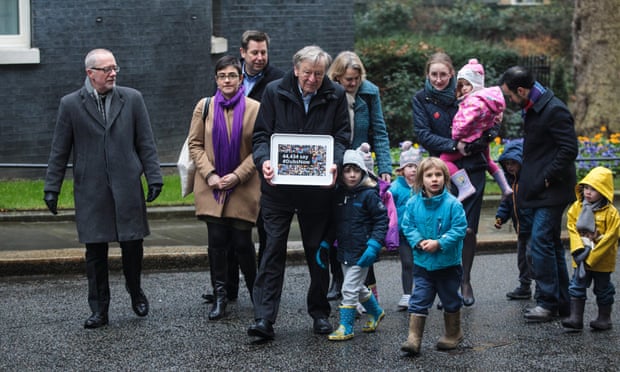 Lord Alf Dubs (C) arrives with council leaders and children to deliver a petition to 10 Downing Street calling on the government to reconsider its decision to end the ‘Dubs’ scheme.