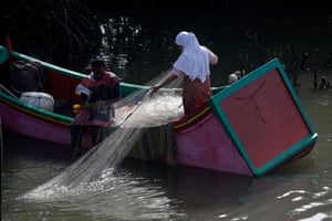 Fisherman at work in the Syiah Kuala beach area. The Aceh government has initiated a local sharia-based law that regulates the use of coastal areas for the development of local communities