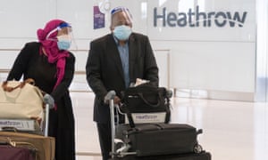 People arrive at Terminal 5 of Heathrow Airport in London on 8 June 2020.