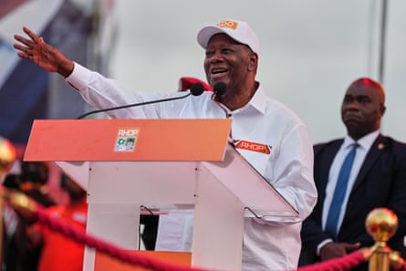 Alassane Ouattara speaks during his final campaign rally at Republic Square in Abidjan