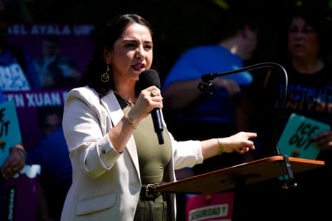 a woman speaks into a microphone