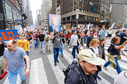 People marching in the street with signs