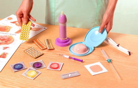 sex education tools, including condoms, pills and a fake penis with a condom on it