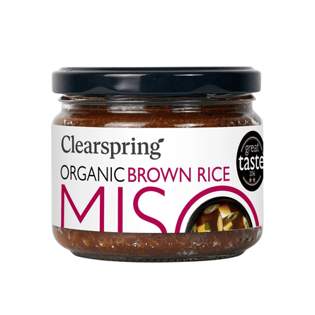 A jar of Clearspring Organic Brown Rice Miso paste with a black lid