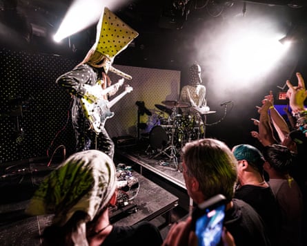 Masked band performing live