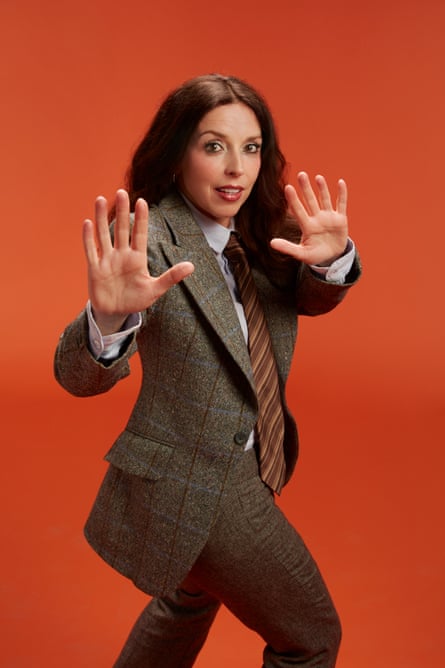 Bridget Christie dressed in a tweed suit in imitation of Kate Bush