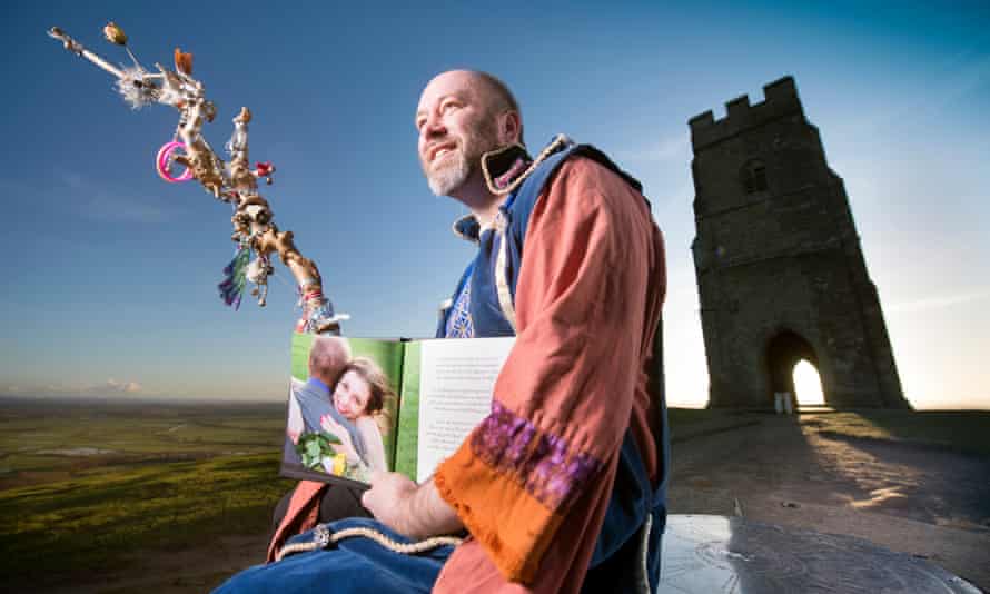 Wes White the Bard of Glastonbury who has an American wife Erica Viloa, pictured on Glastonbury Tor.