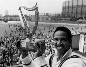 The captain of the Rest of the World, Gary Sobers, with the Guinness Trophy, after his team beat England at the Oval to take the series