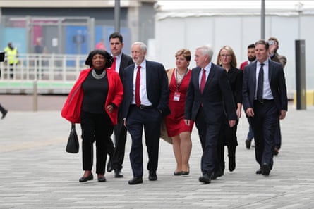 Group of the Labour shadow bench in 2018 looking a little like in the opening of Reservoir Dogs as they walk across a plaza.
