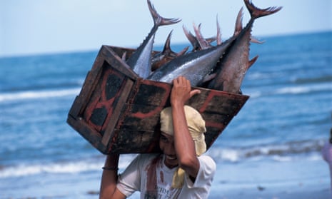 A fisherman in the Philippines with a tuna catch.