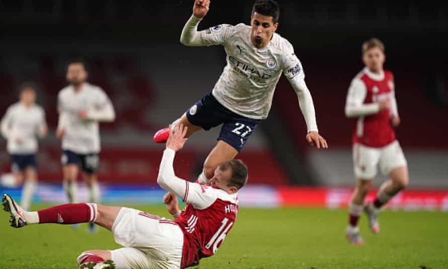 Cancelo is fouled by Rob Holding on one of his marauding runs.
