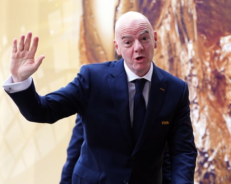 Gianni Infantino raises his hand