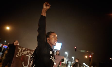 Protests Build in Ferguson Ahead of Grand Jury Announcement<br>ST. LOUIS, MO - NOVEMBER 23: Demonstrators march through the streets while protesting the shooting death of 18-year-old Michael Brown on November 23, 2014 in St. Louis, Missouri. Tensions in Ferguson remain high as a grand jury is expected to decide this month if Ferguson police officer Darren Wilson should be charged in the shooting death of Michael Brown. November 23, 2014.(Photo by Sebastiano Tomada/Getty Images)