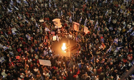 Relatives and supporters of Israeli hostages held in Gaza protest in front of the Defence Ministry in Tel Aviv yesterday.