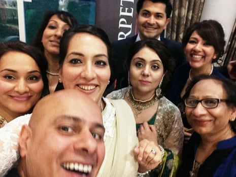 Saima Mir (wearing white) with her three sisters, mother, husband (front) and extended family in 2015.