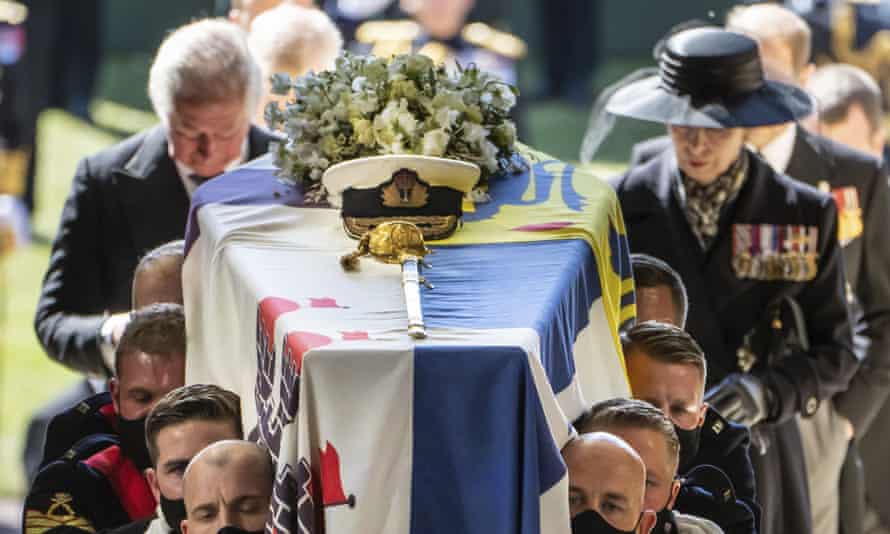 Pall Bearers carrying the coffin of the Duke of Edinburgh, followed by the Prince of Wales, left and Princess Anne, right, into St George’s Chapel.