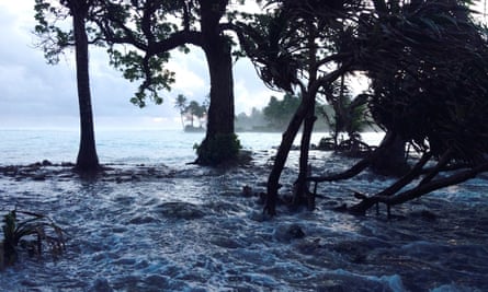A storm surges washes across Ejit Island in Majuro Atoll, Marshall Islands.