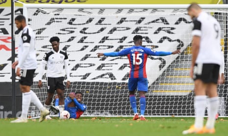 Crystal Palace’s Wilfried Zaha (on floor) reacts after scoring their second goal.