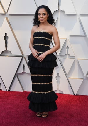 Tessa Thompson, who presented best score, came in a black strapless column dress with gold trim from Chanel's spring/summer 2019 couture show, making her one of the few celebrities to wear a piece by the late designer, Karl Lagerfeld. Apparently the dress took 225 hours to make
