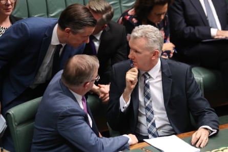 Anthony Albanese, Tony Burke (R) and Mark Butler (L) confer in the House of Representatives in 2019.