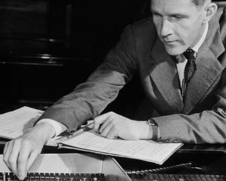 John Cage changing the tuning of his piano by placing coins and screws between the strings in 1949.