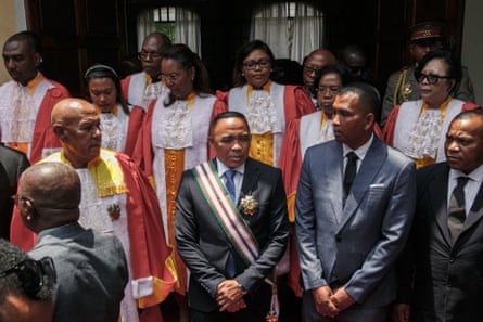 The president of Madagascar Michael Randrianirina (C) poses for a photograph after his swearing in ceremony in Antananarivo, Madagascar.