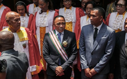 Col Michael Randrianirina wearing a suit with commemorative sash