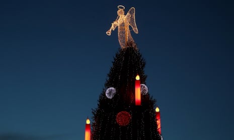 A Christmas tree stands in a Christmas market in Germany.
