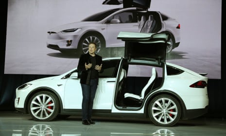 Tesla CEO Elon Musk introduces the falcon wing door on the Model X electric sports-utility vehicles during a presentation in Fremont, California, the United States, on Sept. 29, 2015.