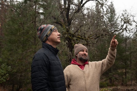 Two men in the woods.