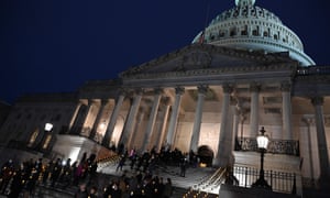 US lawmakers take part in a vigil on the first anniversary of the assault on the US Capitol.