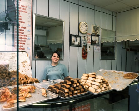 A woman serves behind the counter of a bakery in north-east Turkey