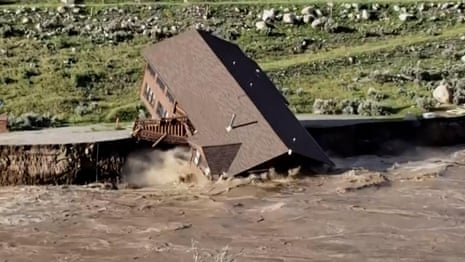The moment a house collapses into a river as major floods close Yellowstone national park – video