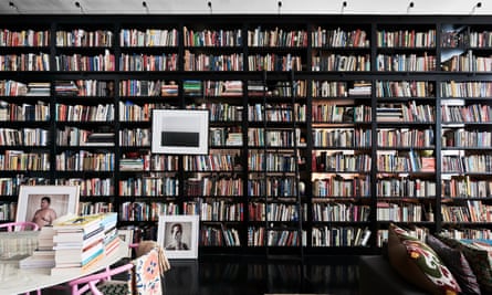 Floor to ceiling and wall to wall books shelves, full of books