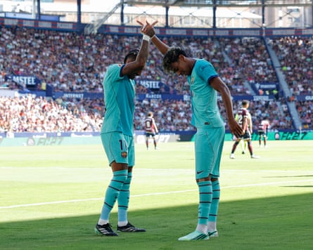 Lamine Yamal (right) celebrates with Raphinha after scoring his first goal against Levante.