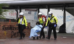 Medical workers escort a protester from Hong Kong’s Polytechnic University.