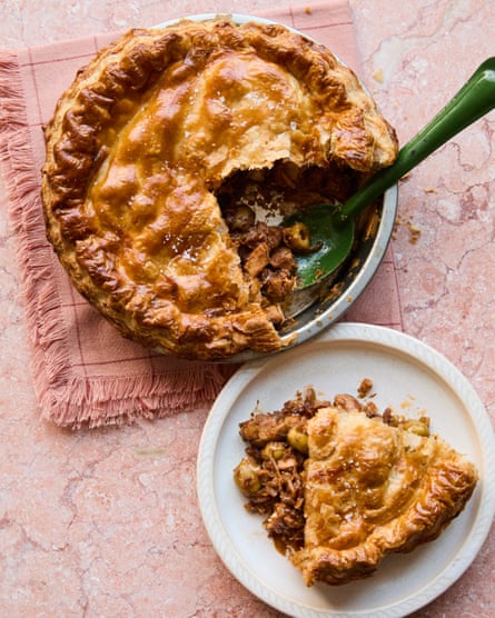 pie covered in golden pastry with a slice removed