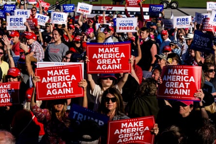 a crowd of people holding signs saying 'Make America great again!' and 'Joe Biden you're fired!'