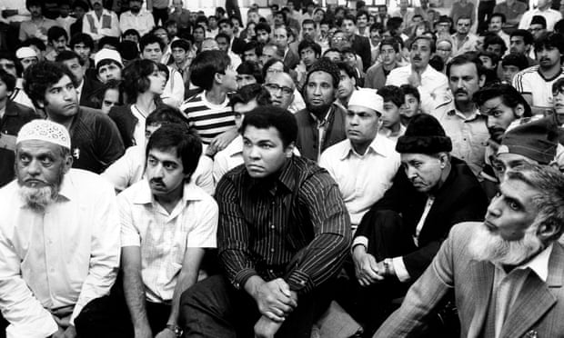 A familiar face among the faithful: Muhammad Ali sits among the congregation at Birmingham’s Central Mosque, after shunning a special seat placed for him to face his fans and fellow-worshippers on 7 August 1983.